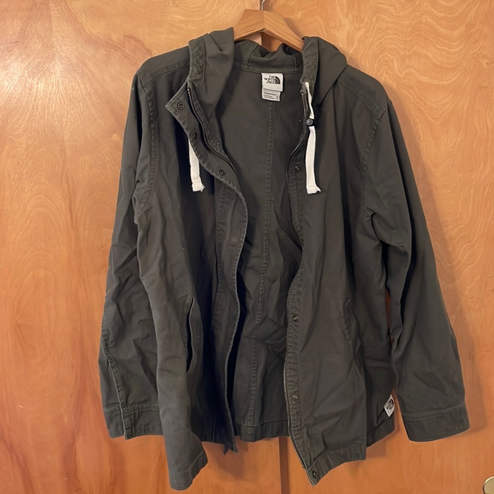 Olive green denim North Face jacket.